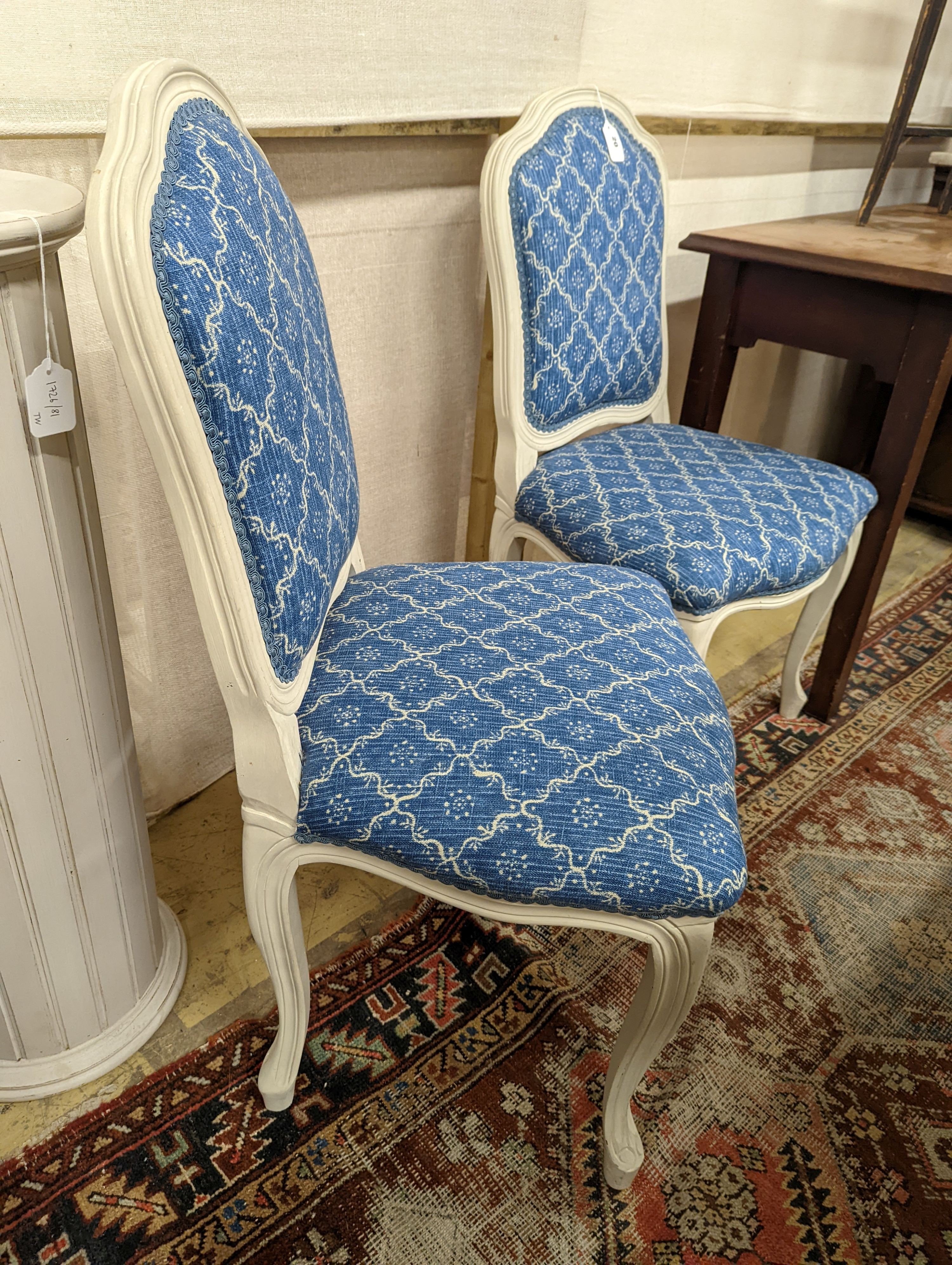 A pair of modern French painted upholstered side chairs